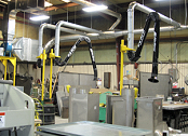 Extractor arms collect galvanized welding fumes.