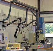 Extractor arms collect oil mist /smoke from machining.